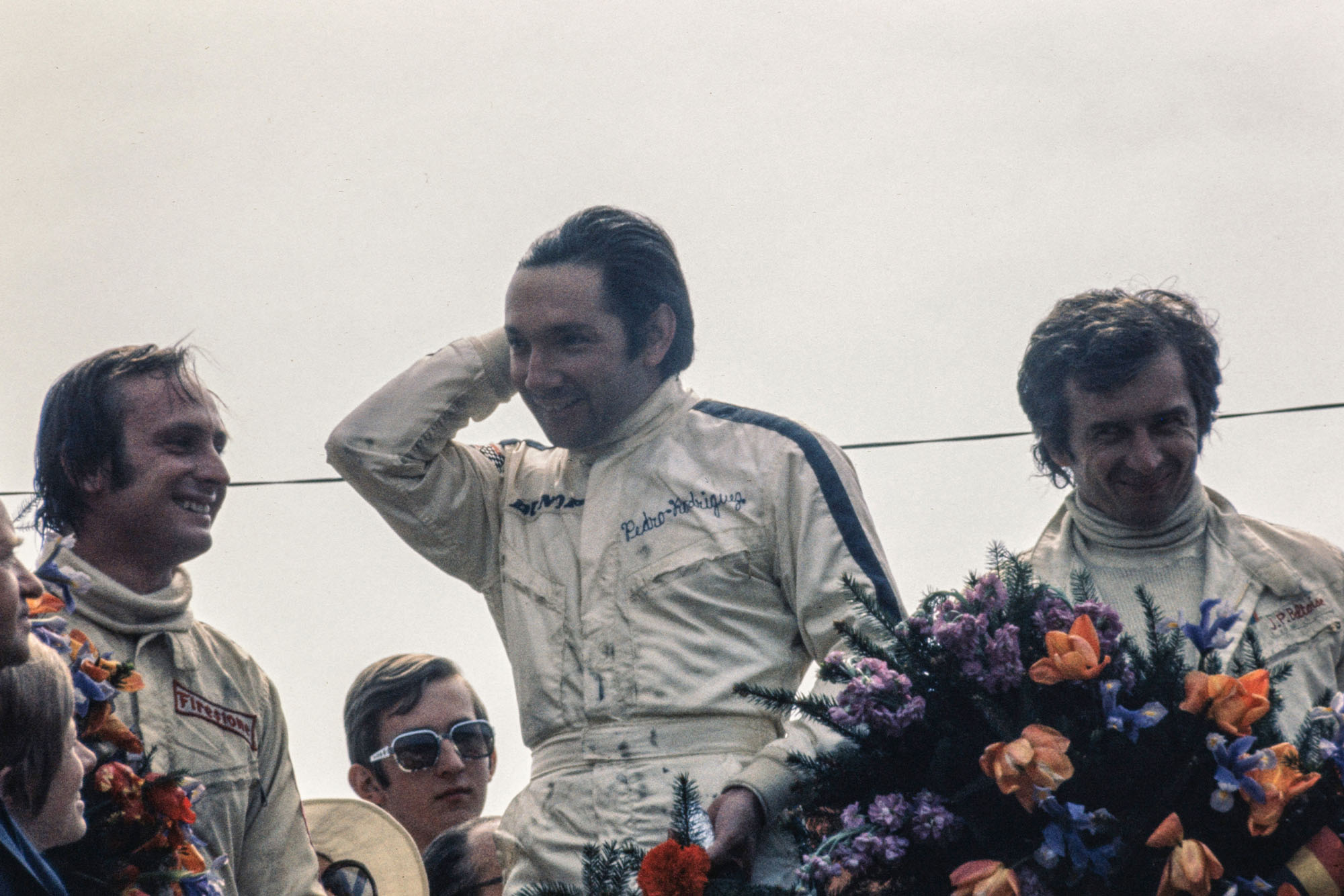 BRM's Pedro Rodriguez stands on the podium after winning the 1970 Belgian Grand Prix.