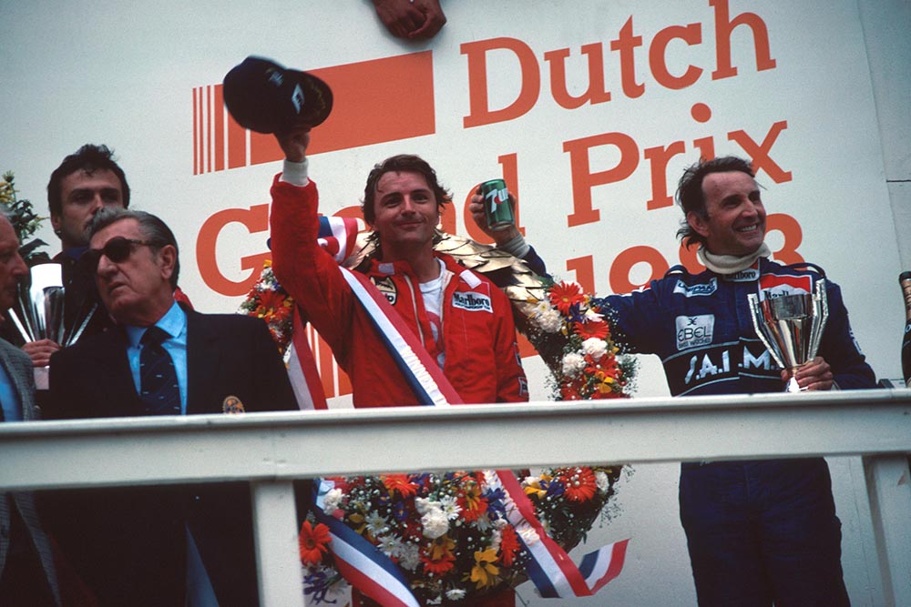 Winner Rene Arnoux and 3rd place John Watson, right and FISA President Jean Marie Balestre, Left.