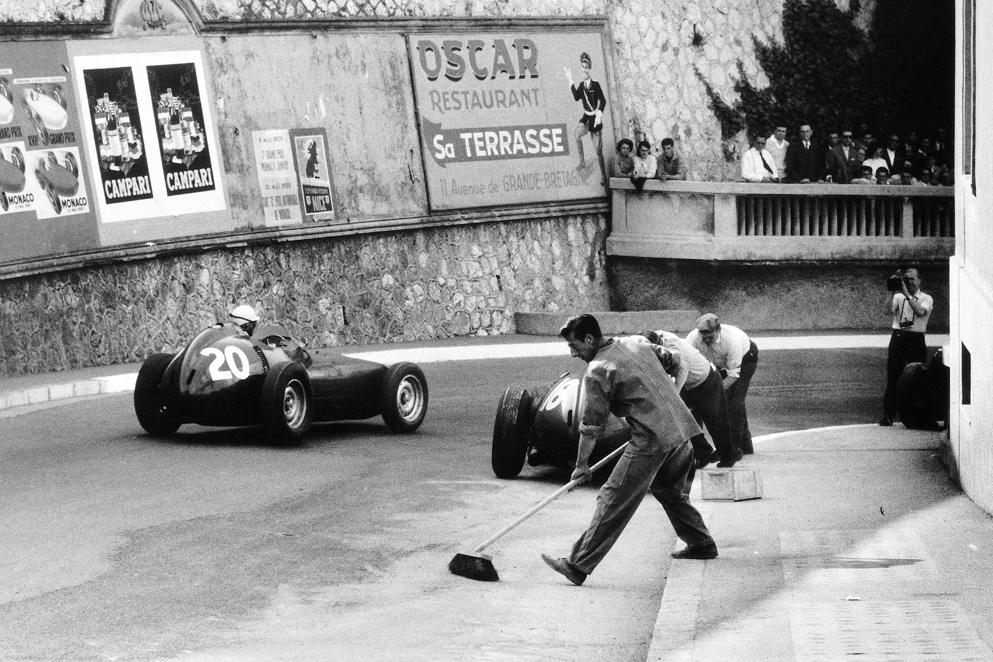 Ron Flockhart in BRM P25 number 20 passes Harry Schell in another BRM P25.