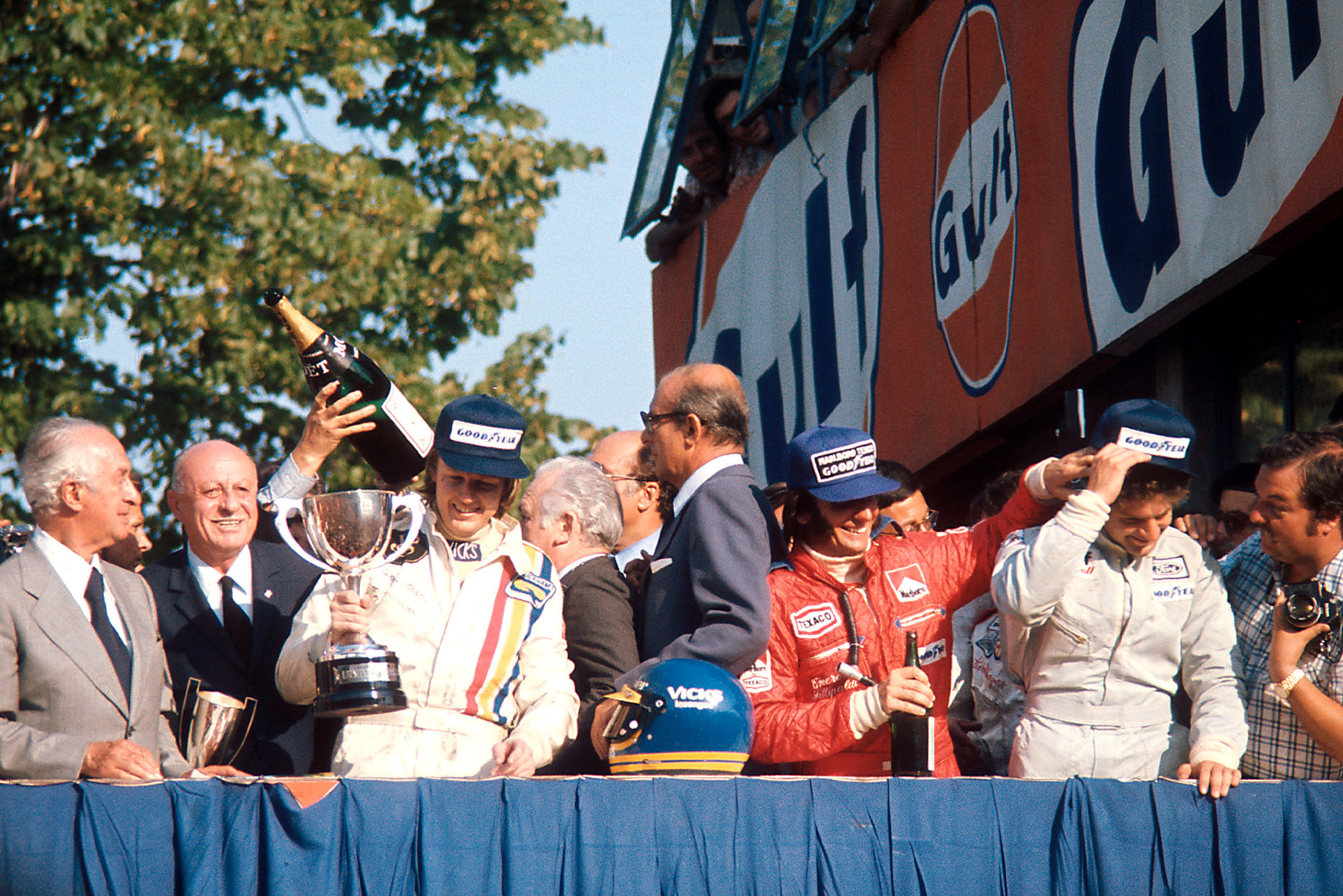 Ronnie Peterson celebrates on the podium at the 1974 Italian Grand Prix, Monza.