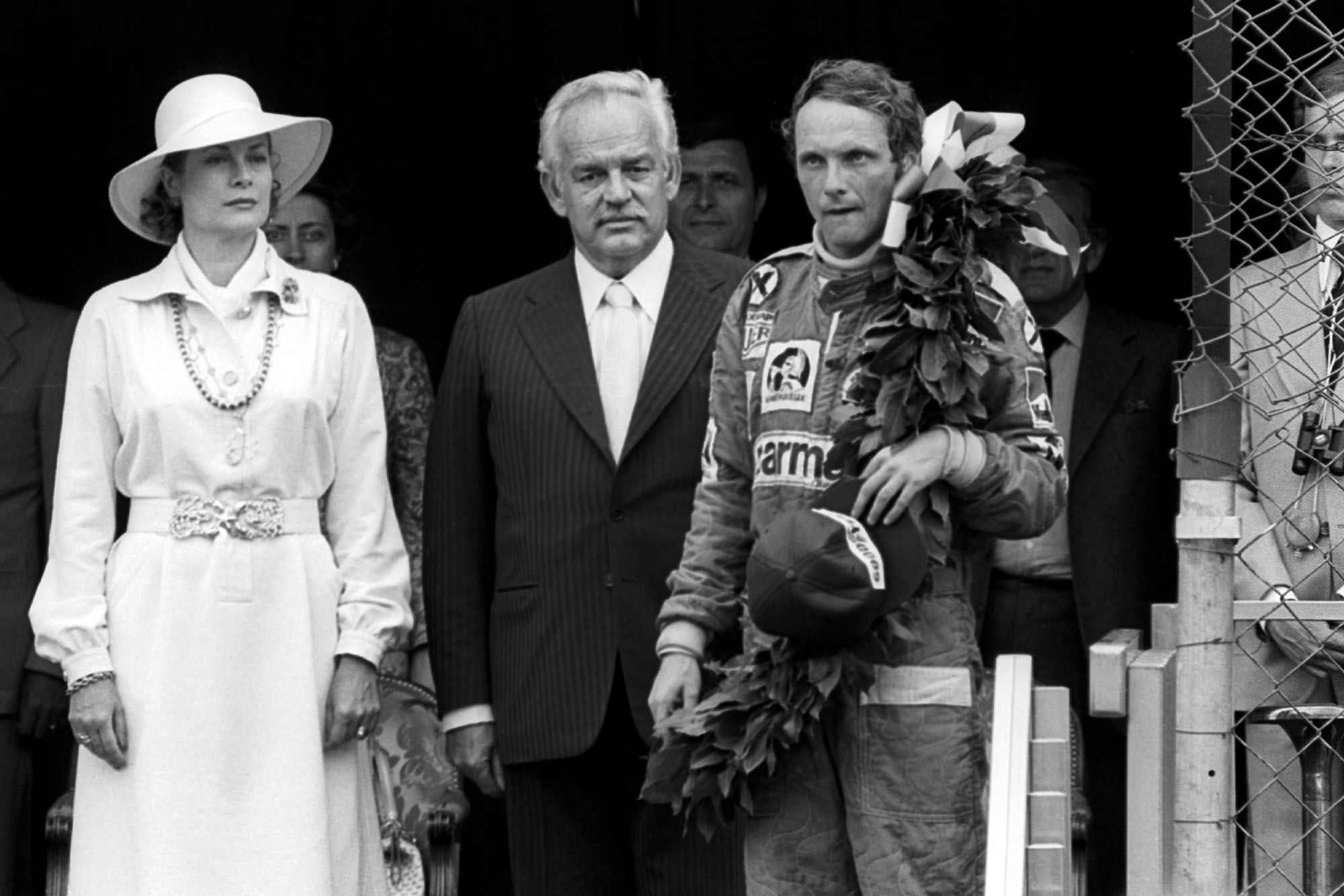 Niki Lauda stands on the podium after emerging victorious at the 1976 Monaco Grand Prix.