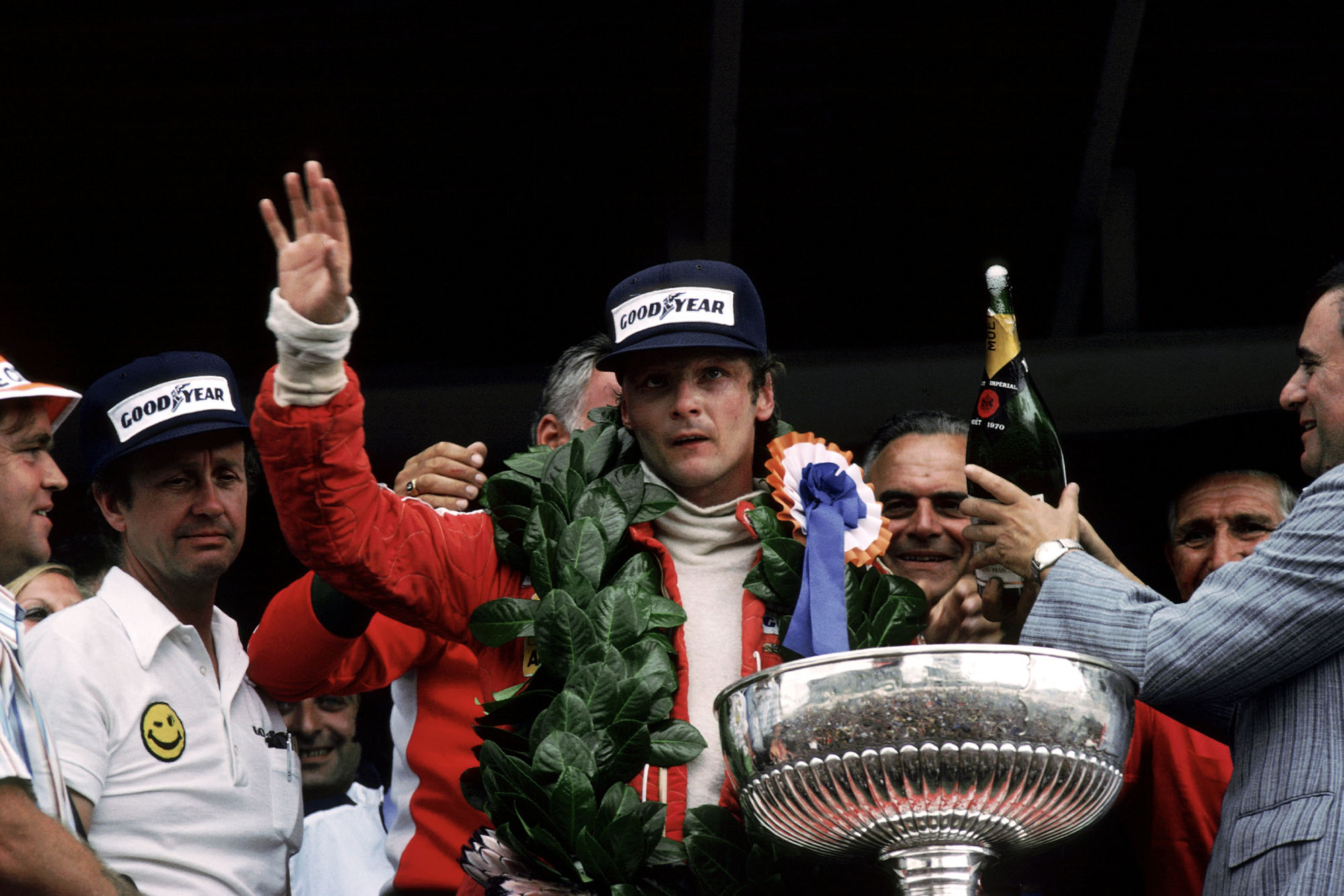 Niki Lauda (Ferrari) waves to the crowd after winning the 1977 South African Grand Prix.