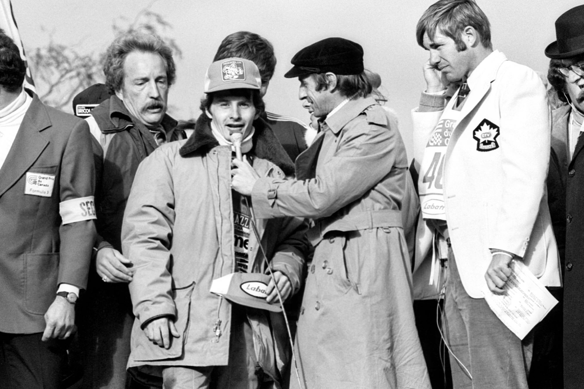 Gilles Villeneuve is interviewed by Jackie Stewart after winning the 1978 Canadian Grand Prix, Montreal.