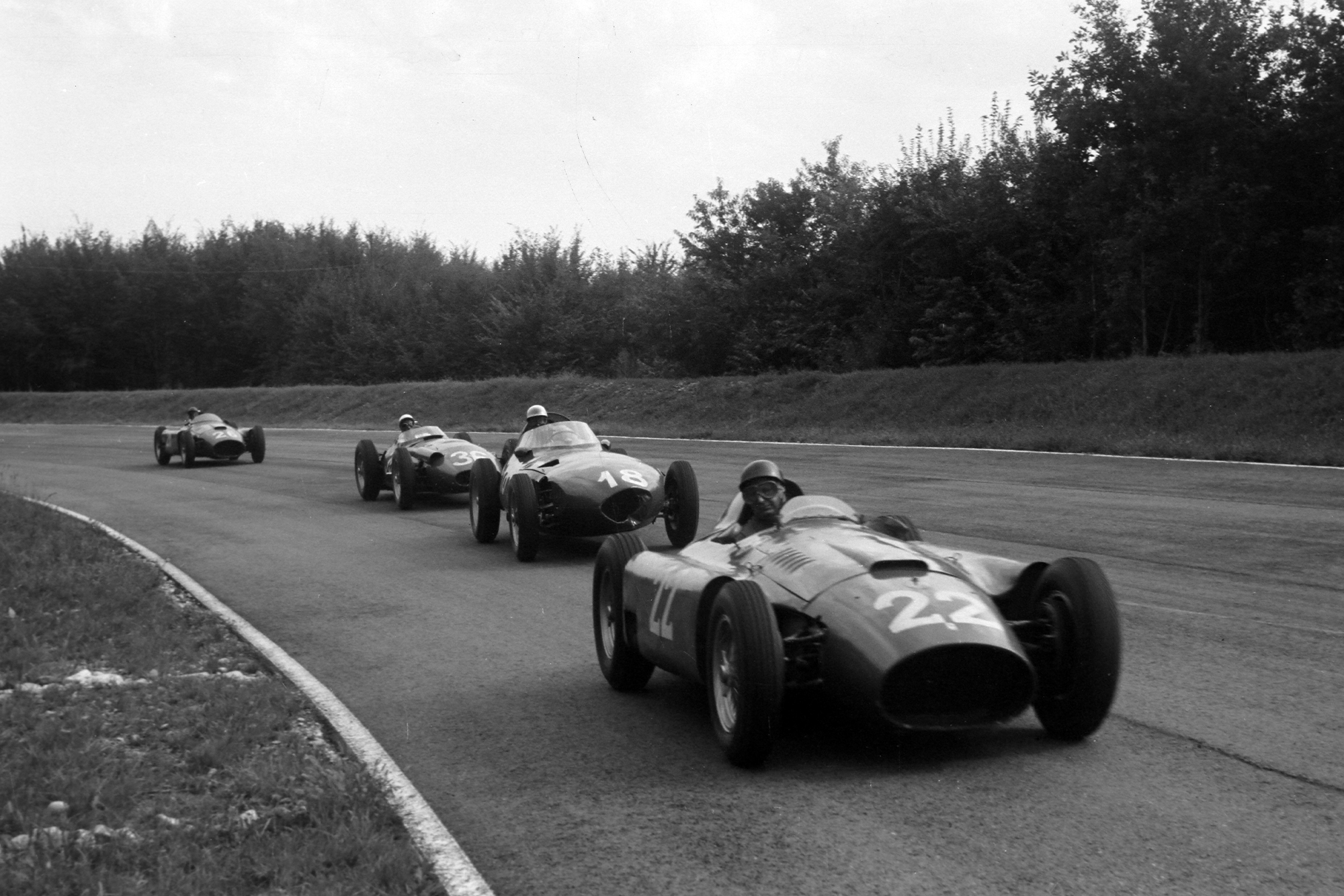 Juan Manuel Fangio/Eugenio Castellotti, Ferrari D50, leads Harry Schell, Vanwall, Stirling Moss, Maserati 250F, and Peter Collins/Juan Manuel Fangio, Ferrari D50 t the 1956 Italian Grand Prix, Monza.