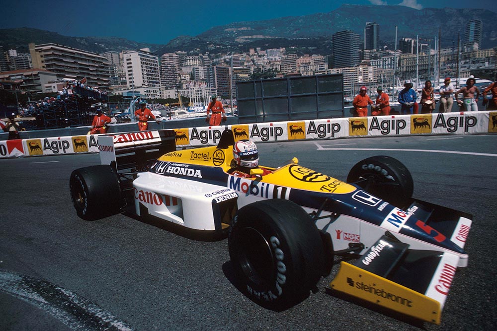 Nigel Mansell driving his Williams FW11 to 4th place.
