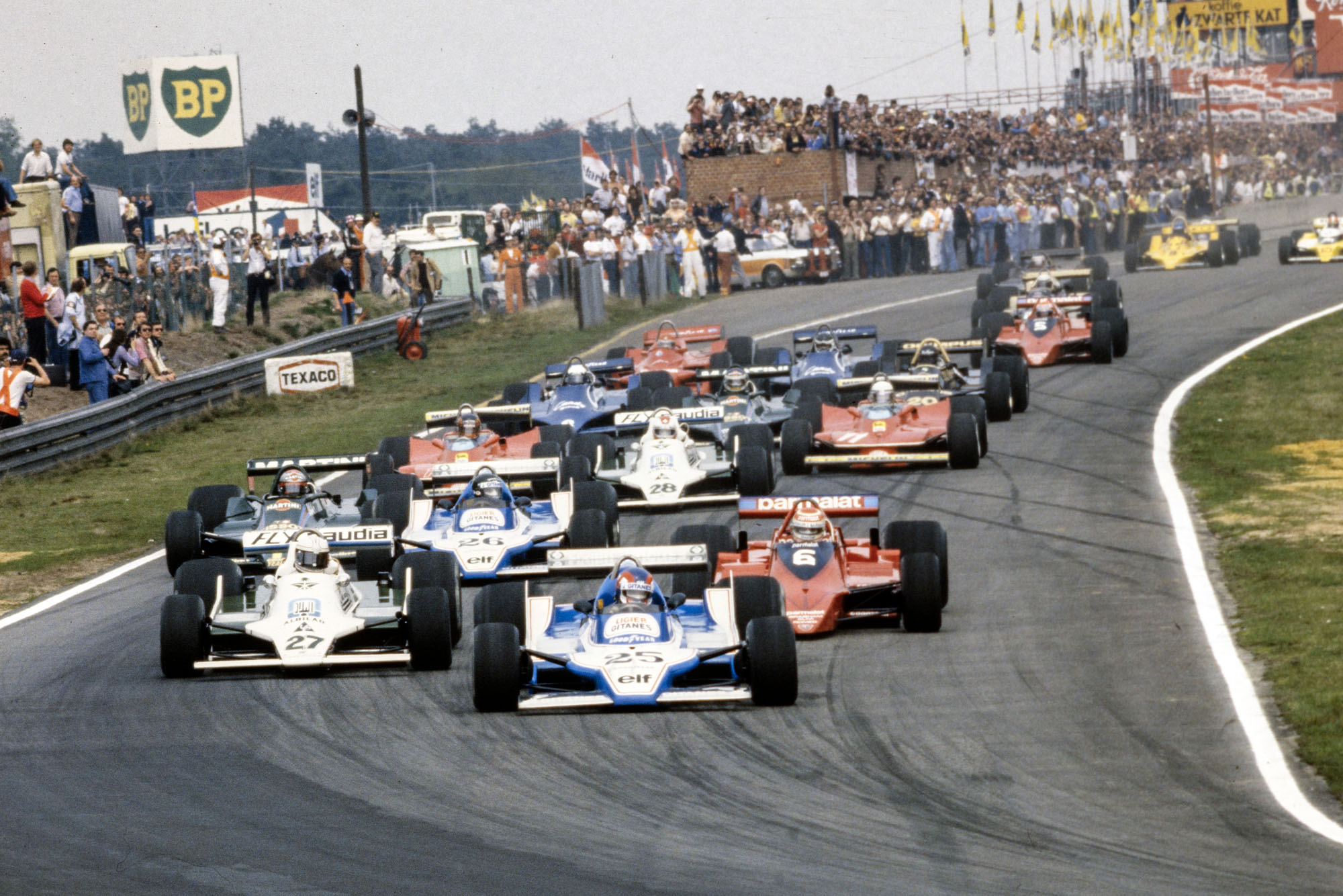 Patrick Depailler's Ligier leads the pack into the first corner, 1979 Belgian Grand Prix, Zolder.