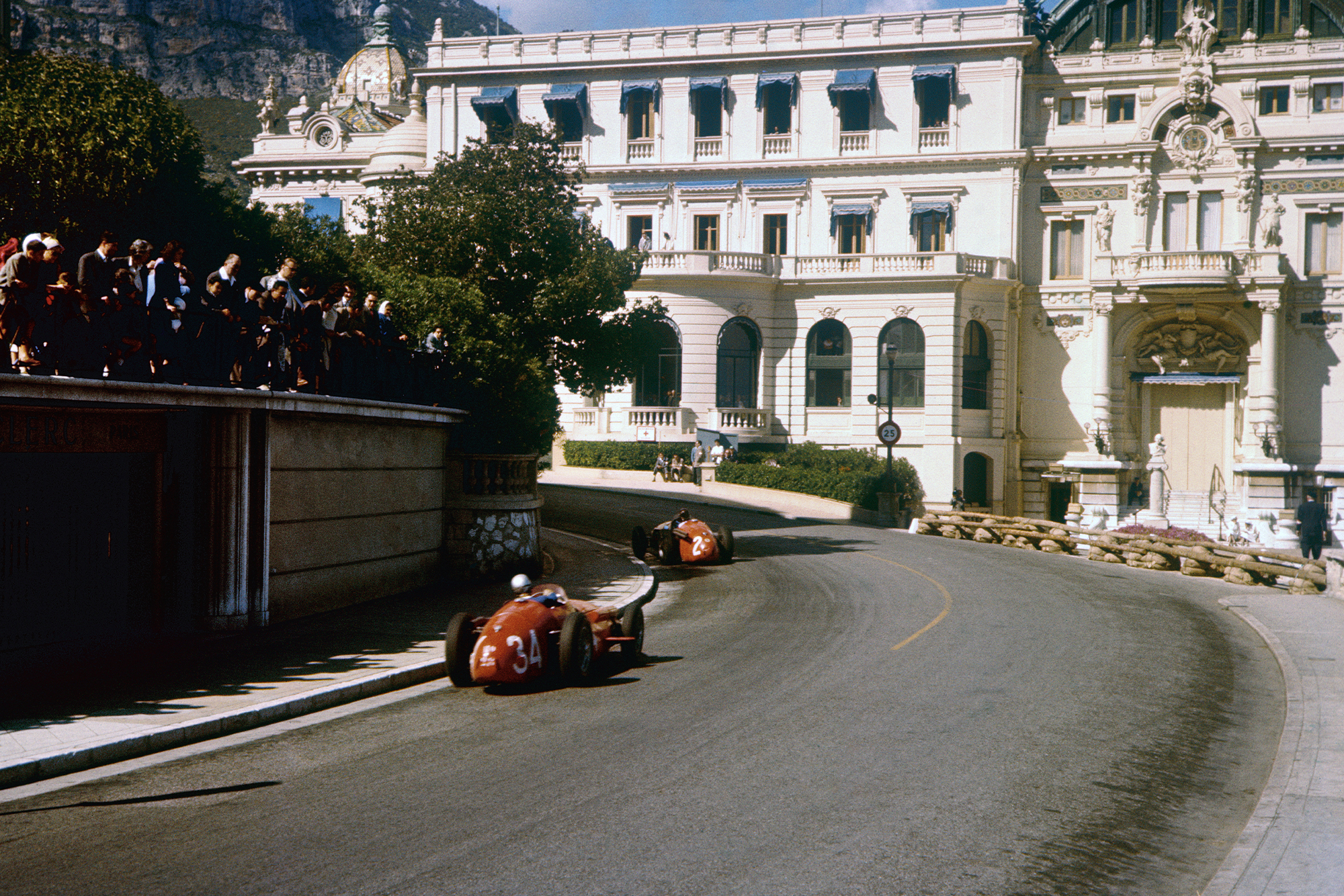 Masten Gregory leads Giorgio Scarlatti (both Maserati 250F) heading towards the casino, 1957 Monaco Grand Prix.