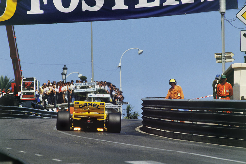 Lotus 99T Honda charges up hill.