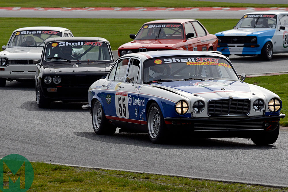 David Howard in his Jaguar XJ12 seeks to hold off nimbler rivals at Oulton Park