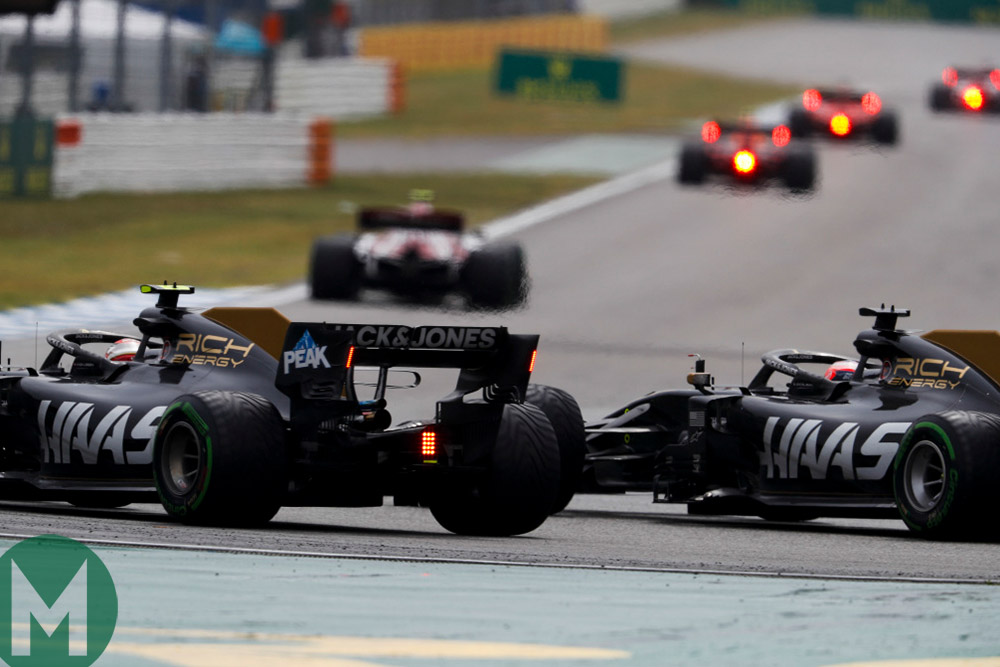 Romain Grosjean and Kevin Magnussen make contact during the 2019 German Grand Prix