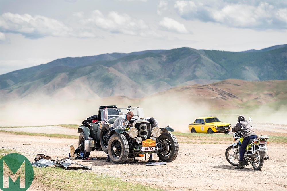 2019 Peking to Paris rally - Artur Lukasiewicz and Bill Cleyndert perform some maintenance on their 1931 Chrysler CM 6