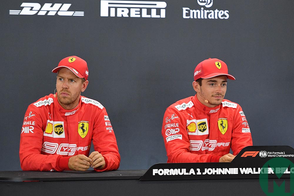 Sebastian Vettel looks away, sat next to pole-sitter Charles Leclerc at the 2019 Belgian Grand Prix