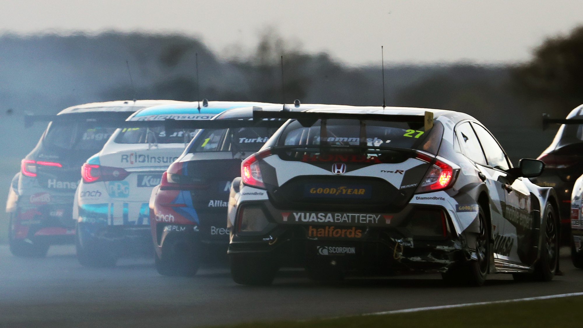 Four cars battle at Snetterton in the 2020 BTCC round