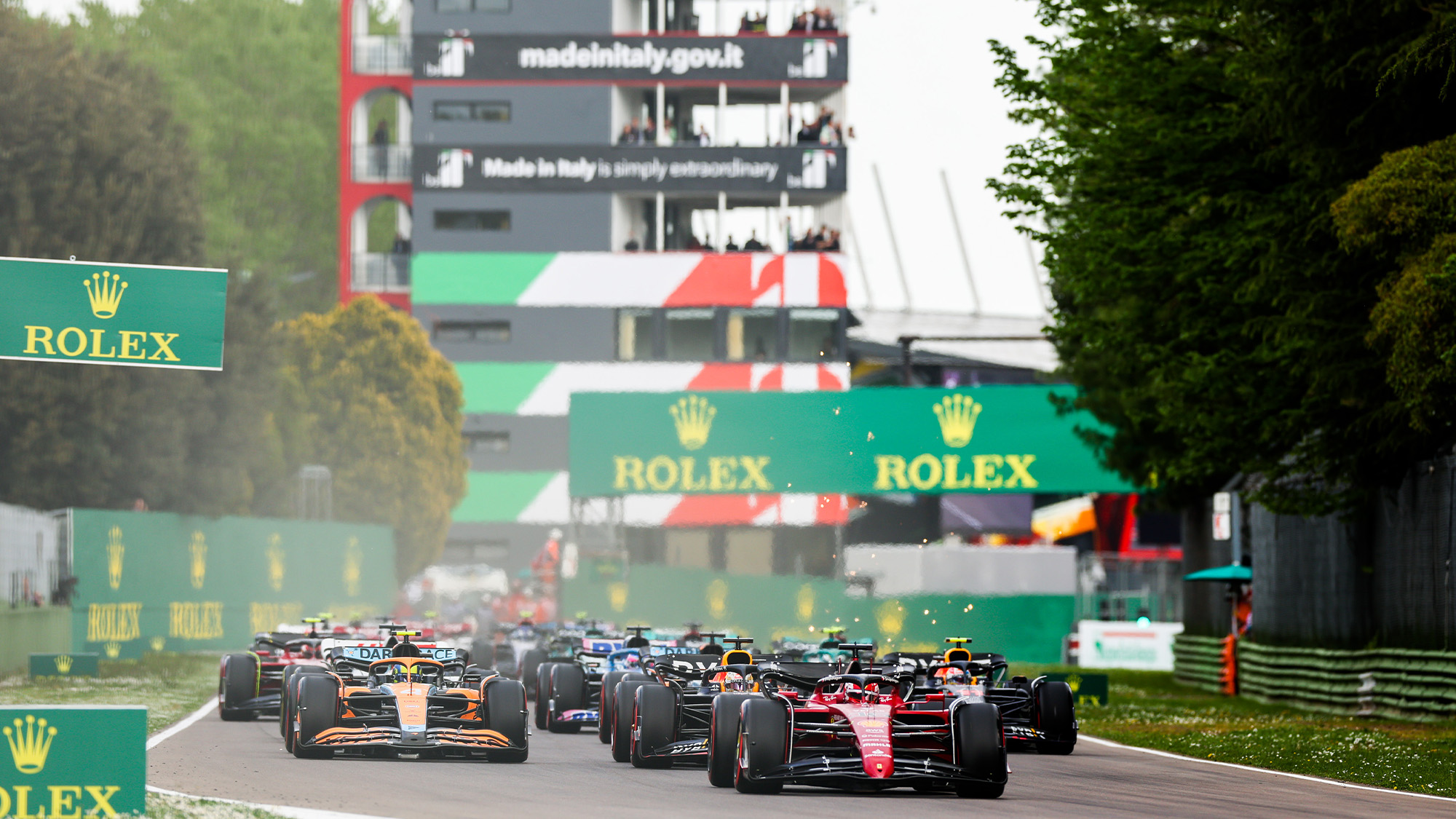 harles Leclerc leads at the start of the 2022 Emilia Romagna GP