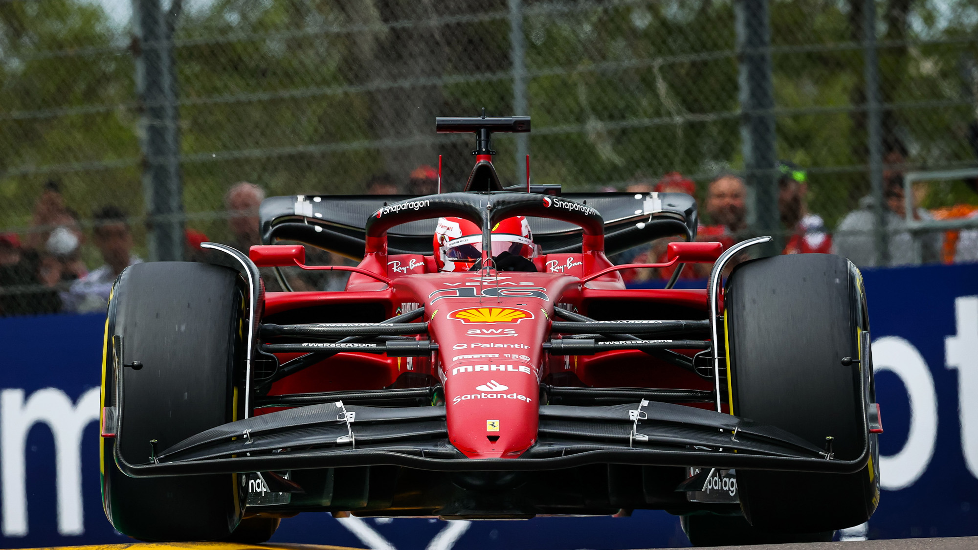 Charles Leclerc bounces over an Imola kerb at the 2022 Emilia Romagna GP